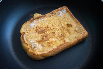 cooking for a french toast on frying pan