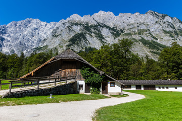 View of Alp mountains and green field from Konigsee, Germany