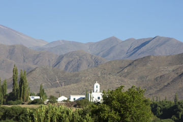 Mansion in Cachi with mountains and blue sky, North Argentina