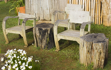 Empty wooden chairs in the garden on the hill