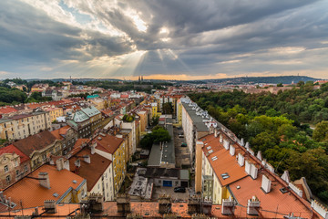 Fototapeta na wymiar View of Prague taken from Nuselsky bridge on sunset captures typical local architecture from aerial perspective. Famous Vysehrad castle is behind it.
