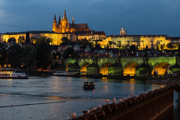 The historic center of Prague, ancient architecture, and cultural heritage/Prague at night Charles Bridge to the river and the old town center