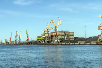 Fototapeta na wymiar Unloaded wagons with coal in port