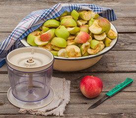 Sliced apple jam in a bowl next to the mixer