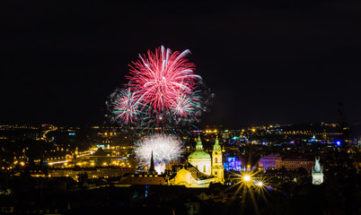 Fireworks illuminate the sky over Charles bridge, Czech Republic