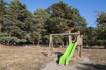 Slide in a recreational area in Canencia mountain pass, Madrid, Spain