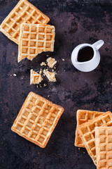 Belgian waffles with powdered sugar and chocolate sauce.selective focus