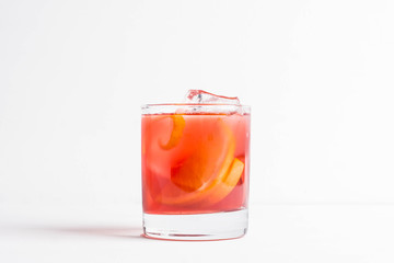 Old fashioned cocktail on the wooden background