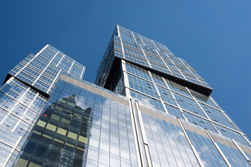 Fototapeta na wymiar High-rise buildings on clear blue sky 