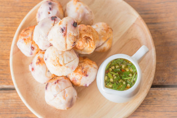 Squid grilled ball on wooden plate