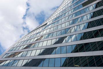 Building on blue sky with clouds, close up view