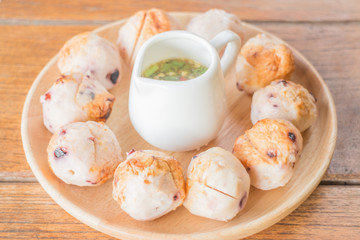 Squid grilled ball on wooden plate