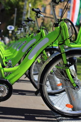 Fototapeta na wymiar Bike rental service/Many bikes in a city context 