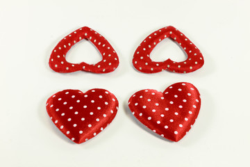 The red hearts on the white background.
