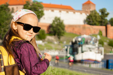Cute little girl having a rest outdoors
