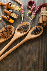 Herbs and Spices over wooden background