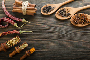 Herbs and Spices over wooden background