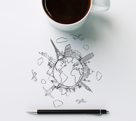 Landmarks with cup of coffee and pen