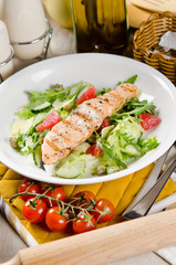 Salmon grilled with mixed salad of fresh fruits and vegetables