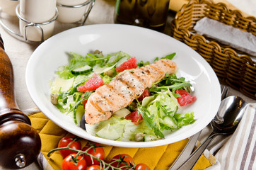 Salmon grilled with mixed salad of fresh fruits and vegetables