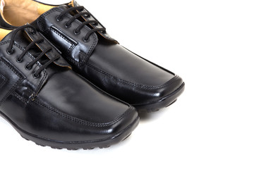 a pair of black leather shoes for men isolated on white available with clipping path