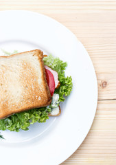 Healthy ham sandwich with cheese, tomatoes and lettuce