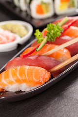 sushi pieces with chopsticks