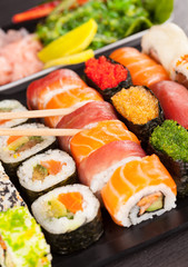 sushi pieces with chopsticks