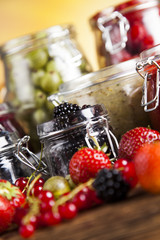 Set of glass jars with fruits jam 