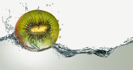 Ripe fruit of kiwi and sparks of water.