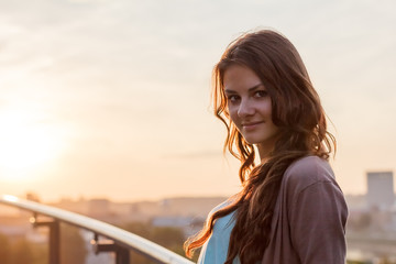 beautiful girl on the background of old houses