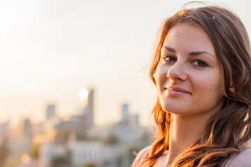 Obraz premium beautiful girl on the background of old houses