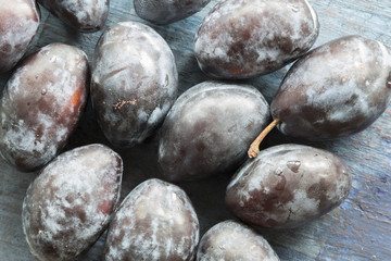 Ripe plums on the table.