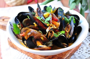 soup of wild mussels with white wine, vegetables, sage and coriander