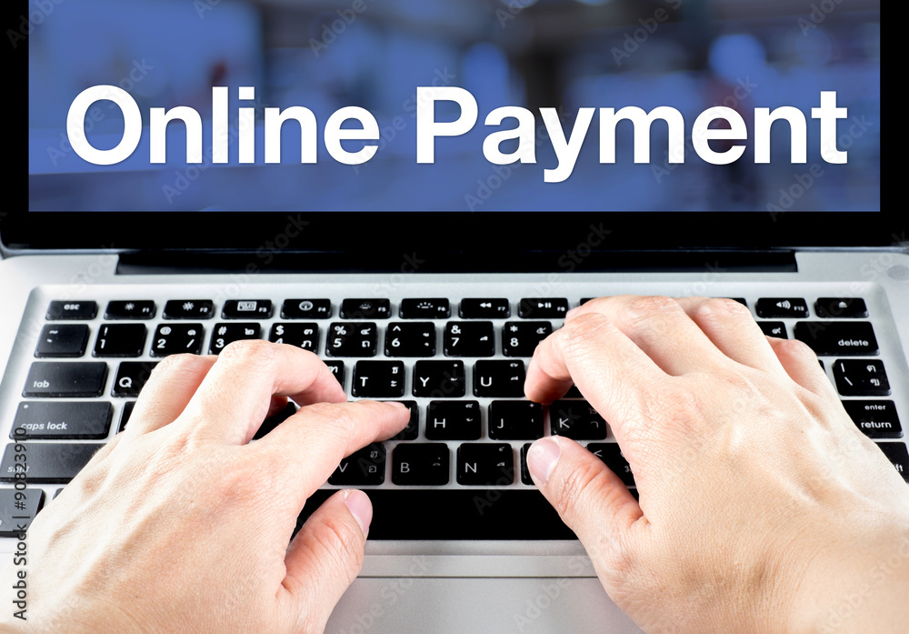 Poster online payment word on notebook screen with hand type on keyboar