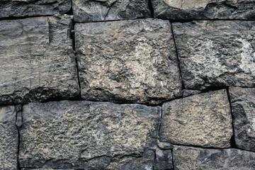 Background texture with rough wall of stone blocks