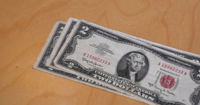 Stacking $2 Bills on a Desk