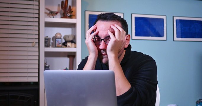 Frustrated Man with Laptop