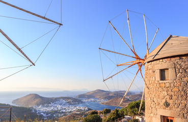 Windmills in the setting sun on the island of Patmos. Dodecanese archipelago in the Aegean Sea in Greece.