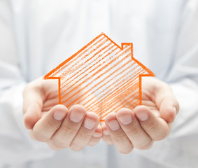 Drawing house in hands