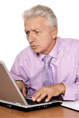  Mature businessman with laptop