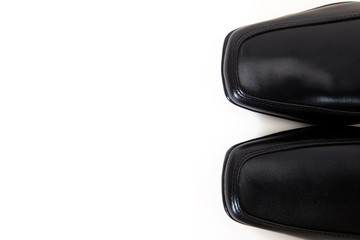 toe of a pair of black leather shoes  for men  with copy space isolated on white available with clipping path