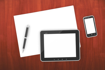 smartphone and tablet PC on a table with a blank screen
