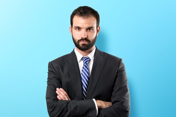 Business man with his arms crossed over isolated background