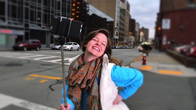 Woman Poses with Selfie Stick