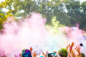 Obraz na płótnie Canvas Celebrants dancing during the color Holi Festival