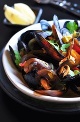 soup of wild mussels with white wine, vegetables, sage and coriander