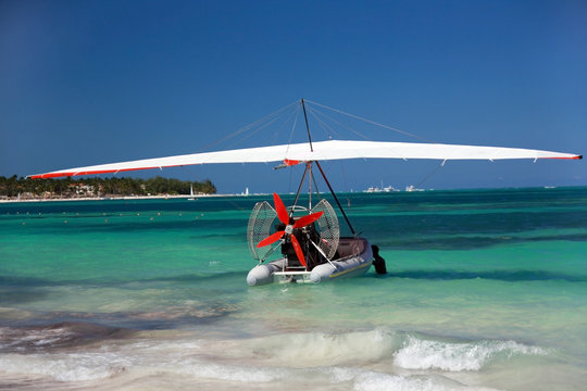 Hang glider on caribbean ocean