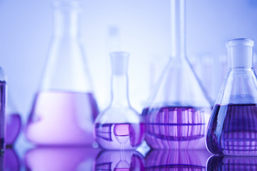 Laboratory work place with microscope and glassware