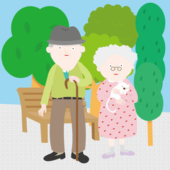 A picture of grandpa and grandma. Grandpa is holding a cane and grandma is holing a white cat. 